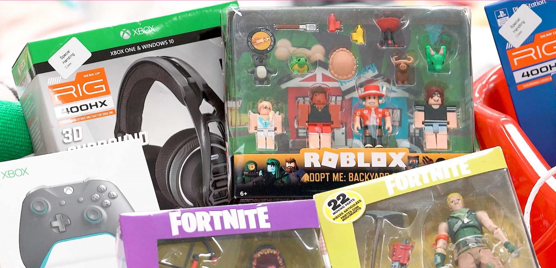 Krazy Bins Xbox Fortnite xbox remote, headphones, robolox dolls, and fortnite dolls box sitting in bin